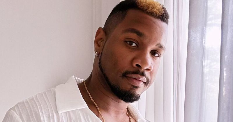 Black male singer performing on stage under spotlight; independent artist recording vocals in studio; emotional live performance; musician playing keyboard in church setting.